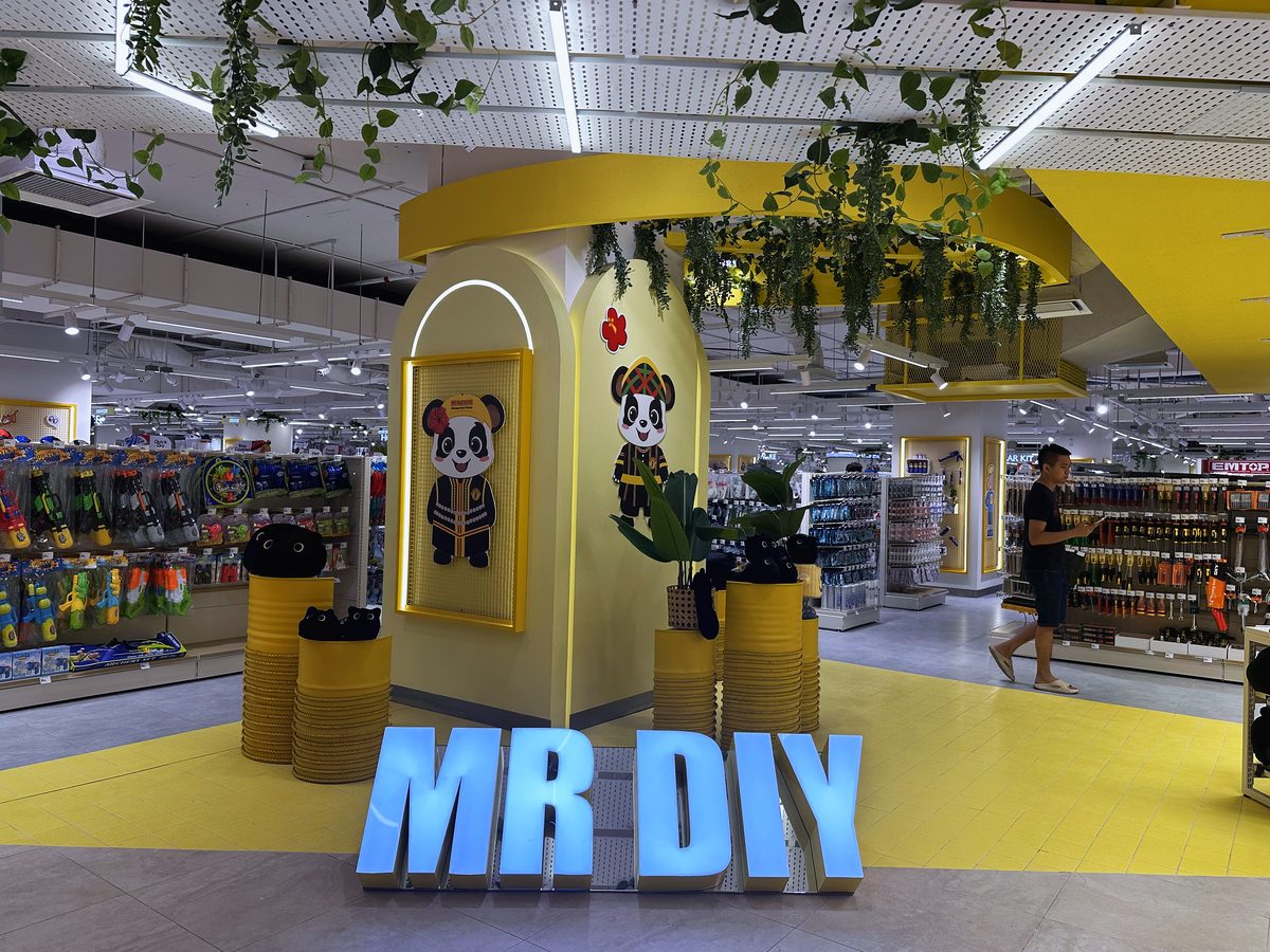 Sculptural signage arch at MR D.I.Y Plus Imago