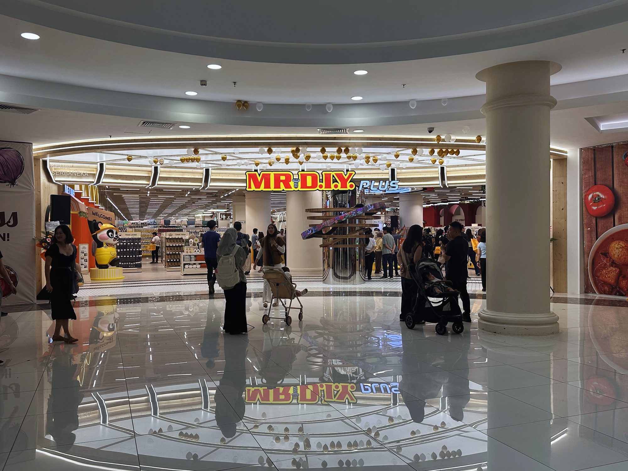 Shoppers gathering at the MR D.I.Y Plus shopfront on opening day