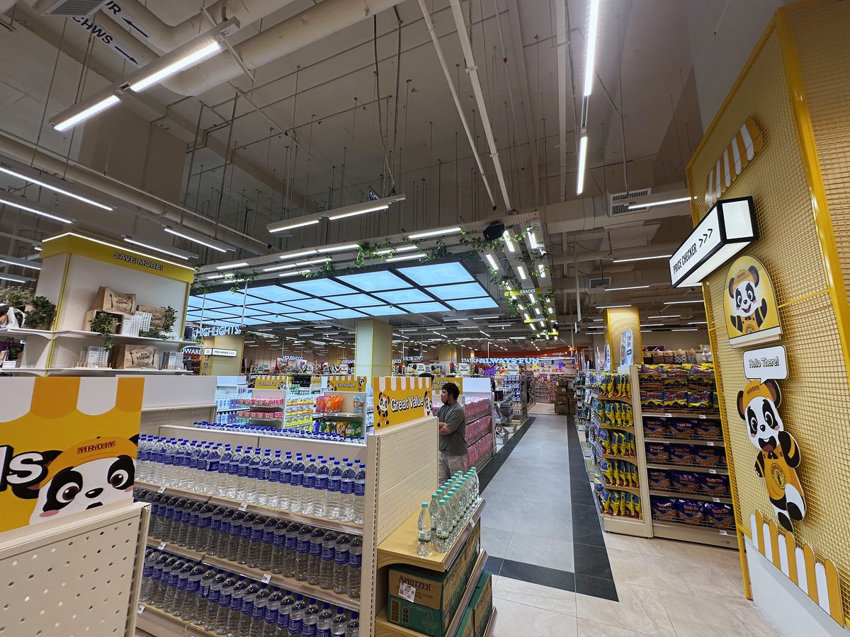 Yellow bulkhead over an aisle at Queensbay